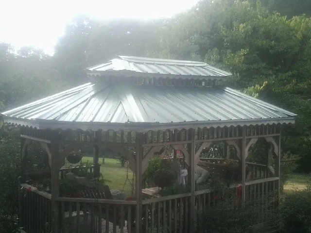 Two tier green metal roof on a garden gazebo in Lithonia